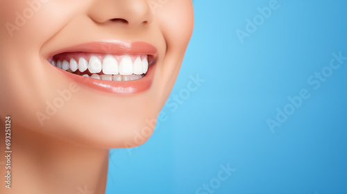 Closeup Of Beautiful Caucasian girl Smile With White Teeth on blue background   Woman Mouth Smiling. dental concept with copy space