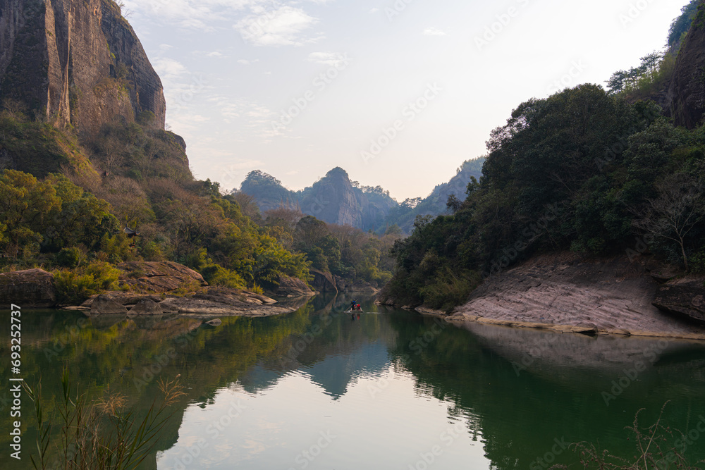 The emerald green water of the Nine Bend River or Jiuxi river, Wuyishan, China The emerald green water of the Nine Bend River or Jiuxi river, Wuyishan, China