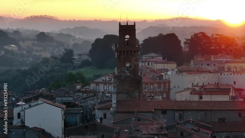 Pitigliano veduta dall'alto del campanile della cattedrale sullo sfondo il borgo medievale e le colline all'alba photo