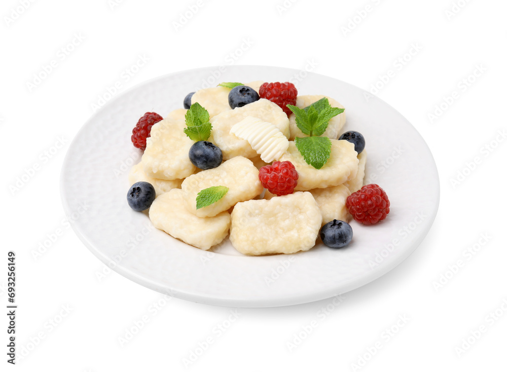 Plate of tasty lazy dumplings with berries, mint leaves and butter isolated on white Plate of tasty lazy dumplings with berries, mint leaves and butter isolated on white