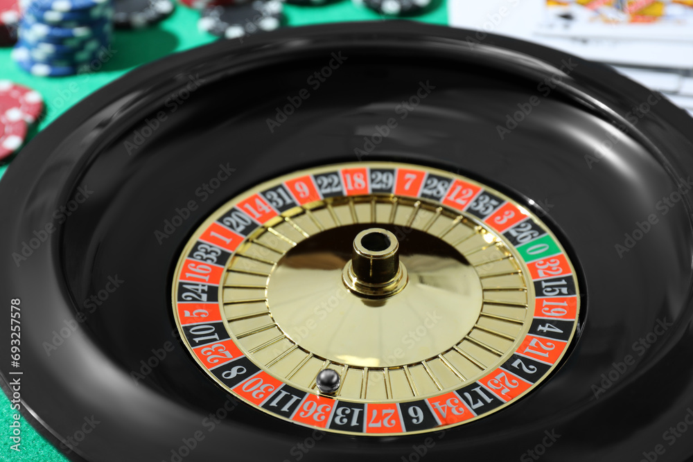 Roulette wheel with ball on table, closeup. Casino game Roulette wheel with ball on table, closeup. Casino game