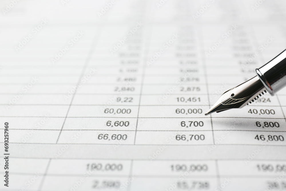 Fountain pen and accounting document with data, closeup. Space for text Fountain pen and accounting document with data, closeup. Space for text
