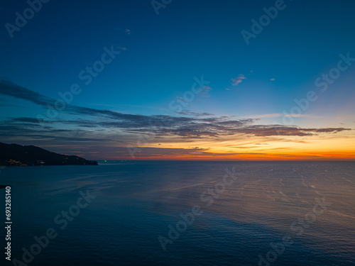 .aerial panorama beautiful sunset at Surin beach Phuket..amazing colorful cloud in beautiful sky at sunset..Scene of Colorful romantic sky sunset with cloud in the sky background..