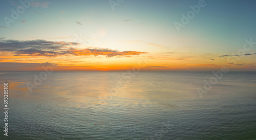 .aerial panorama beautiful sunset at Surin beach Phuket..amazing colorful cloud in beautiful sky at sunset..Scene of Colorful romantic sky sunset with cloud in the sky background.. © Narong Niemhom