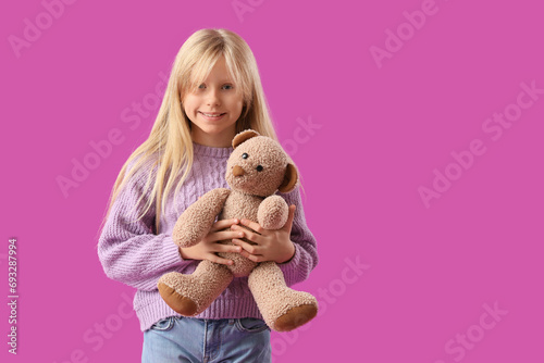 Cute little girl with plush...