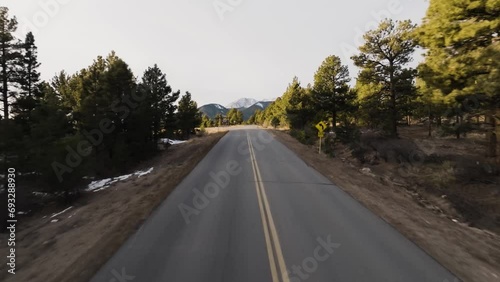 Drone moving down an empty road with Mount Antero in the Rocky Mountains in Colorado in the background photo