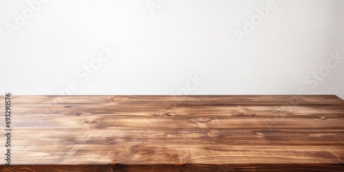 Wooden table with white textured background