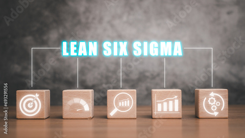 Lean Six Sigma concept, Wooden block on wooden desk with  lean six sigma icon on virtual screen, define, measure, analyze, improve, and control. photo