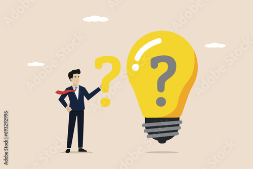 Finding ideas to solve business problems, business difficulties concept, finding solutions, FAQ concept, businessman finding solutions to problems business ideas on idea light bulb.