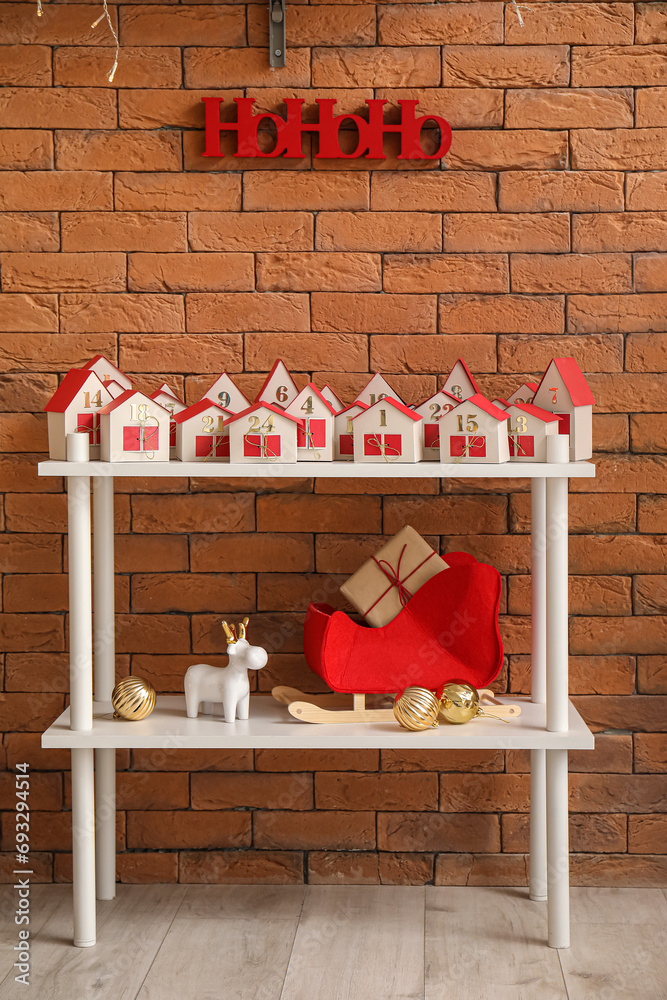 Obraz premium Christmas advent calendar on shelf in room