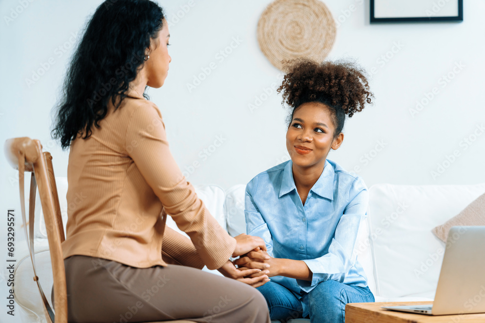 Happy patient and psychologist have mental health conversation in clinic with positive emotion while explaining crucial successful work and life to psychologist in home office - obrazy, fototapety, plakaty 