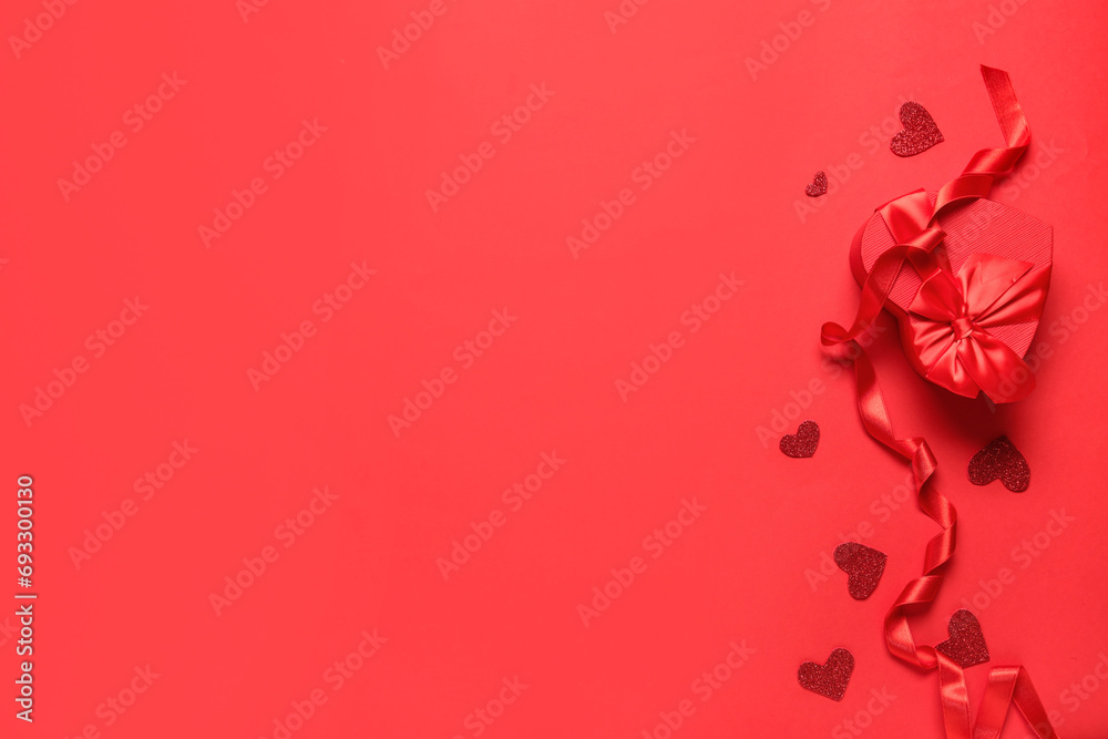 Gift box with ribbon and hearts on red background. Valentine's Day celebration Gift box with ribbon and hearts on red background. Valentine's Day celebration