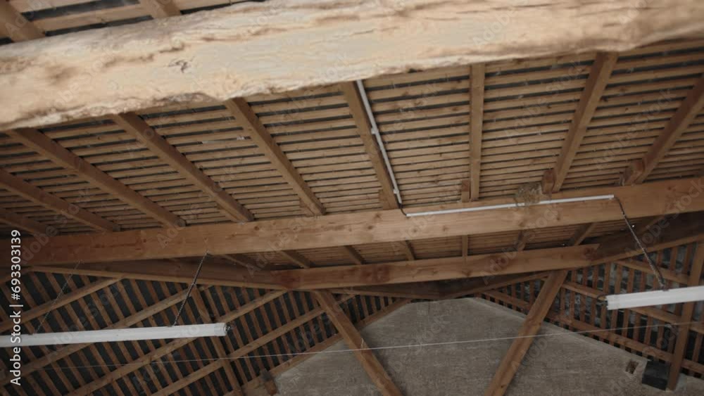 interior shot of a barn wooden roof construction interior shot of a barn wooden roof construction