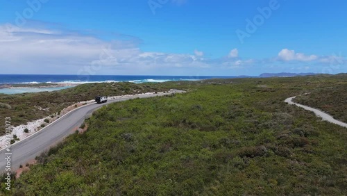 Wallpaper Mural Truck camper driving along coastal road in Western Australia as drone follows behind Torontodigital.ca