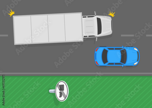Traffic regulation tips and rules. End of no overtaking by heavy goods vehicles sign area. Top view of a truck passing car on road. Flat vector illustration template.