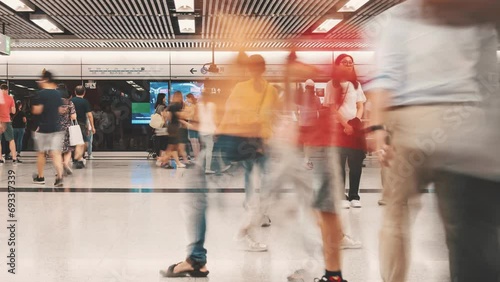 Time lapse crowd of Pedestrians walking in subway transportation hub in rush hour, Hong Kong photo