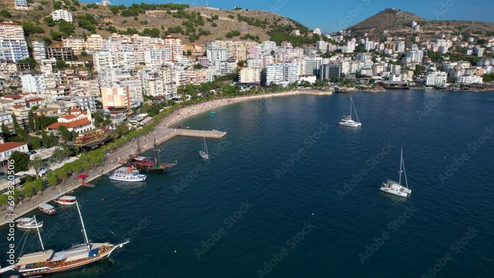 Saranda Panoramic Views of the Mediterranean Bay, Luxury Hotels, Promenade, Anchored Boats, and Ships Adorning the Azure Blue Waters Saranda Panoramic Views of the Mediterranean Bay, Luxury Hotels, Promenade, Anchored Boats, and Ships Adorning the Azure Blue Waters