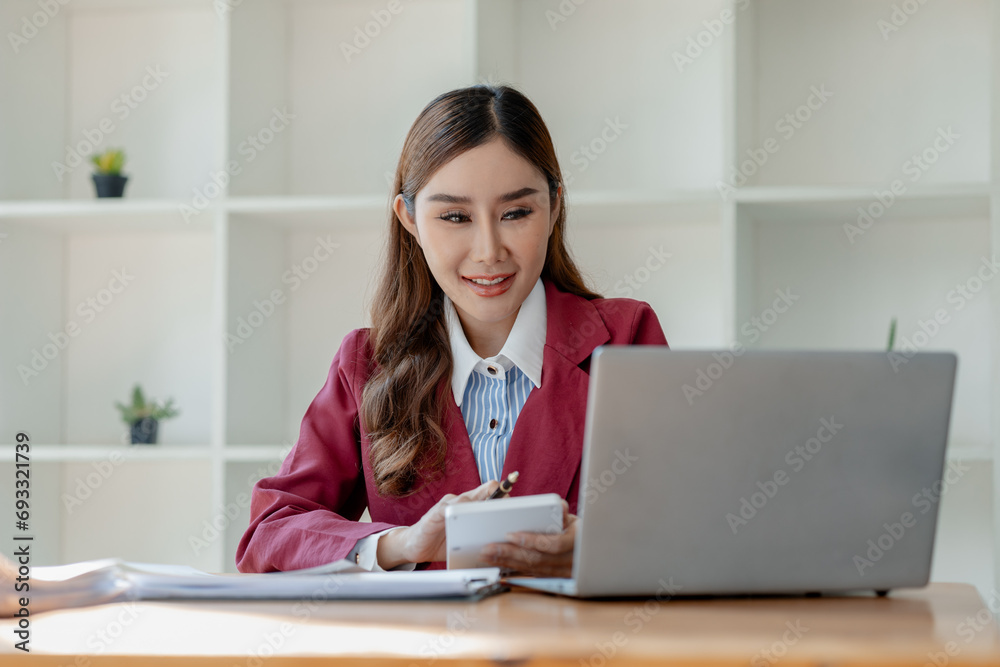 Numerical data is being presented for the accountant to calculate, Female accountant working about financial with calculator at her office, Savings, Finances and economy concept, Numerical data is being presented for the accountant to calculate, Female accountant working about financial with calculator at her office, Savings, Finances and economy concept,