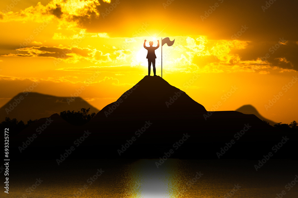 Silhouette of person with flag on mountain top over sky and sunlight background at sunset with copy space