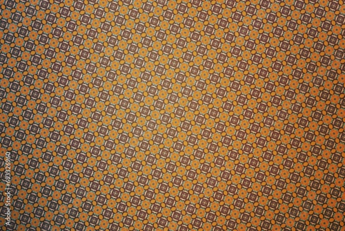 Textile cloth brown and orange with a kaleidoscope pattern