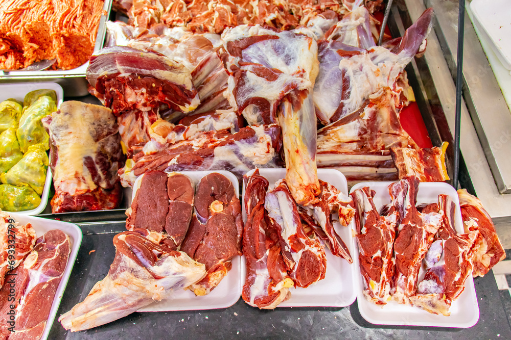 Traditional Butcher's Shop Selling High-Quality Meats and Cuts with Freshness Guarantee.