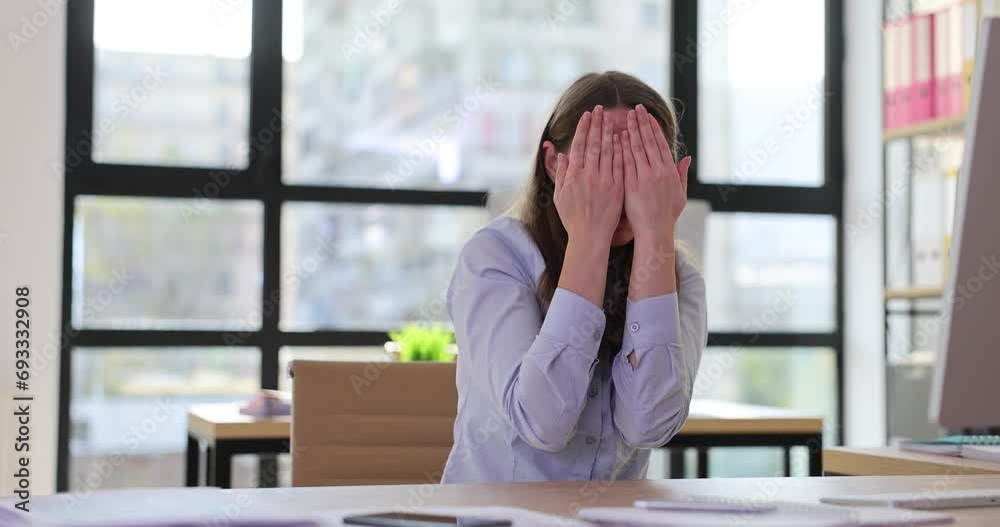 Young office worker woman hiding face with hand Young office worker woman hiding face with hand