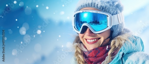 Portrait of snowboarder smiling happy young woman in blue suit goggles mask, hat, ski padded jacket