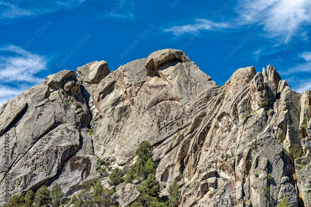 Upward view of the rock formations towering above the Backyard Boulders hiking trail at Castle Rocks State Park, Idaho, USA