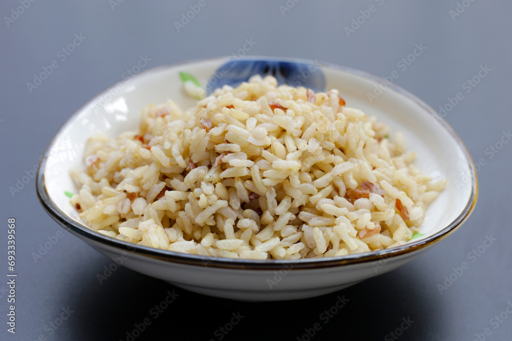 Cooked brown rice on dark background. Cooked brown rice on dark background.