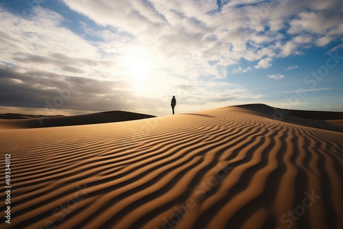 A person standing alone in the vast expanse of a desert. Suitable for travel or adventure themes