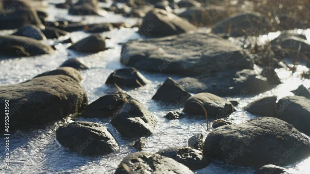 Frozen rocks embedded in an arctic river in summer Frozen rocks embedded in an arctic river in summer