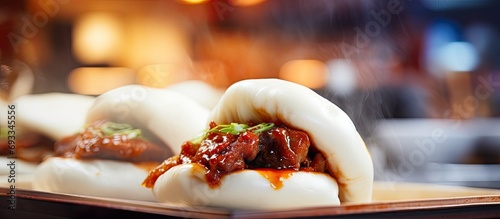 Selective focus on a Vietnamese pork-filled steamed bun at a street market. photo