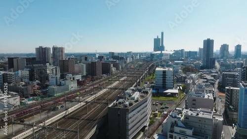 Flying Towards Omiya Station Drone with Shinkansen and Freight Train on Track photo