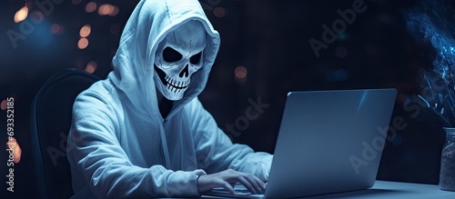 Girl wearing ghost skull mask learns on computer for video call and online study during Halloween.
