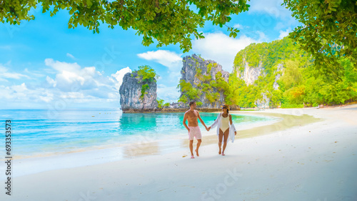 Koh Hong Island Krabi Thailand, a couple of men and women on the beach of Koh Hong during vacation in Thailand, a tropical white beach with Asian women and European men in Krabi Thailand photo