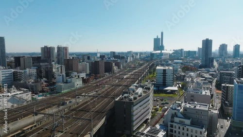 Flying Away from Omiya Station Drone with Shinkansen and Freight Train on Track