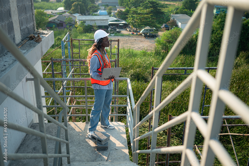 Young female engineer or architect working on construction site Young female engineer or architect working on construction site