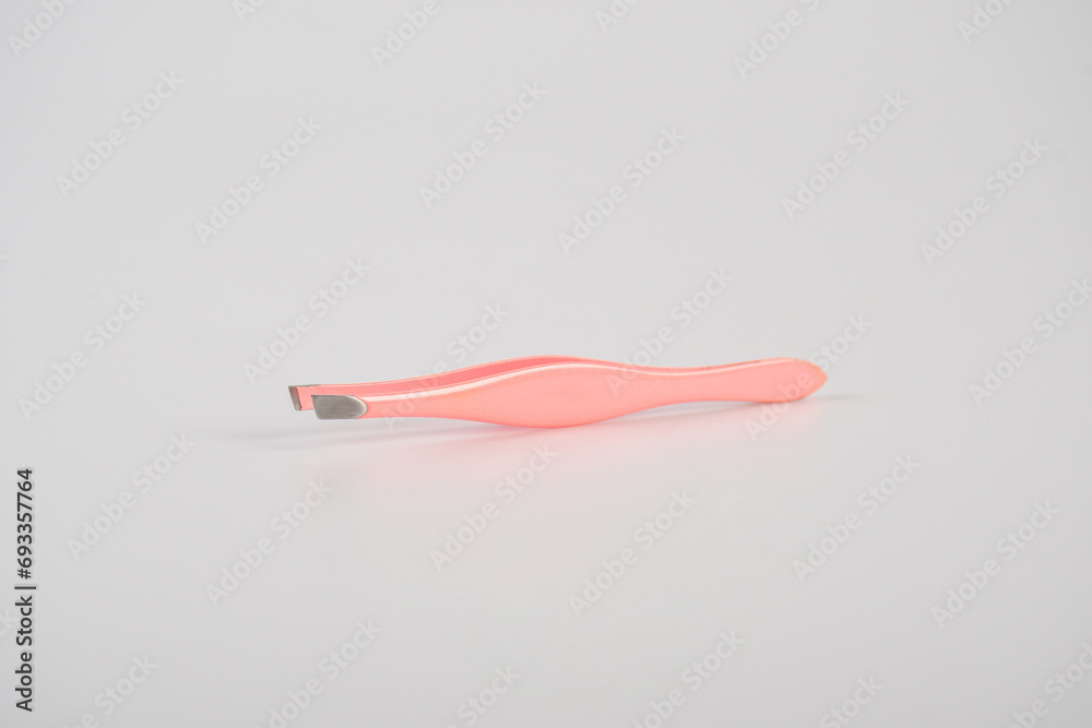 Pink hair tweezers isolated on white background Pink hair tweezers isolated on white background