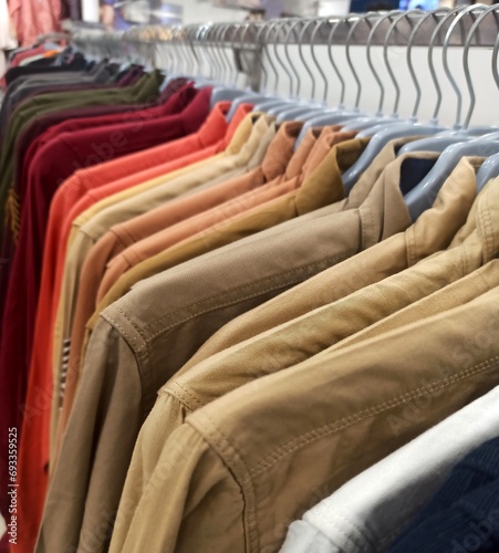 Long sleeved casual shirts arranged on hanger