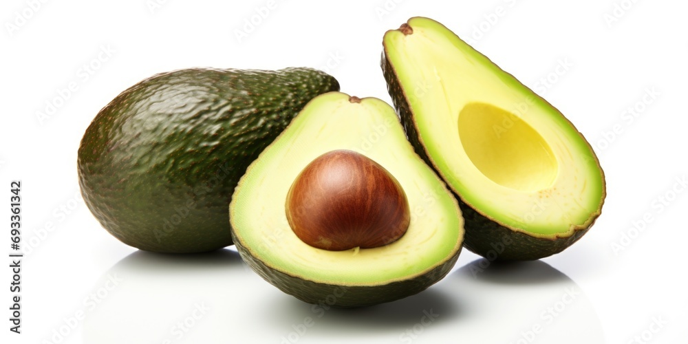 Avocado cut in half alongside a whole avocado. Perfect for recipes, healthy eating, or food blog illustrations