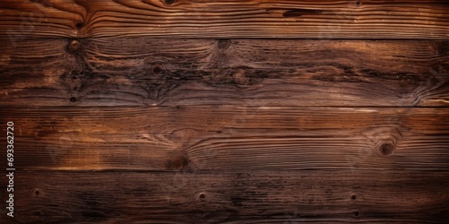 Brown wood texture on old dark surface.