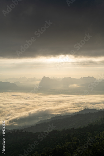 Sunrise over mountain range with sea of cloud, fantastic light, dramatic cloud and beautiful sky (Phu Kradueng, Thailand)