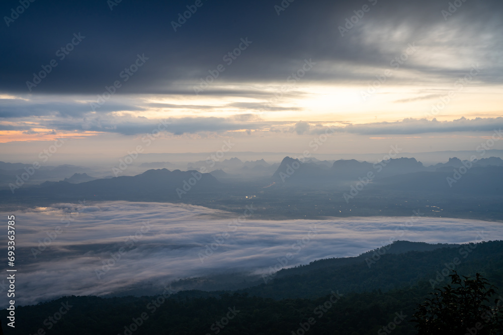 Sunrise over mountain range with sea of cloud, fantastic light, dramatic cloud  and beautiful sky (Phu Kradueng, Thailand)