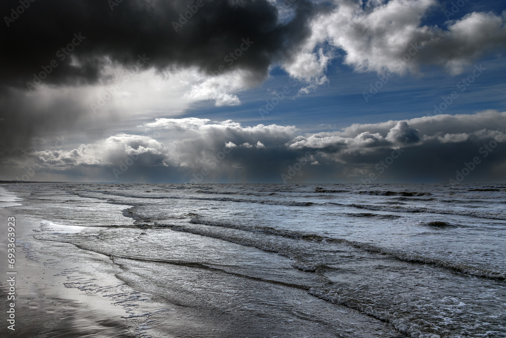 Baltic sea coast and stormy clouds.