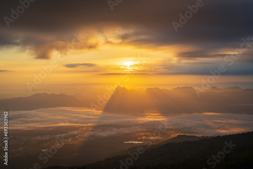 Sunrise over mountain range with sea of cloud, fantastic light, dramatic cloud and beautiful sky (Phu Kradueng, Thailand)