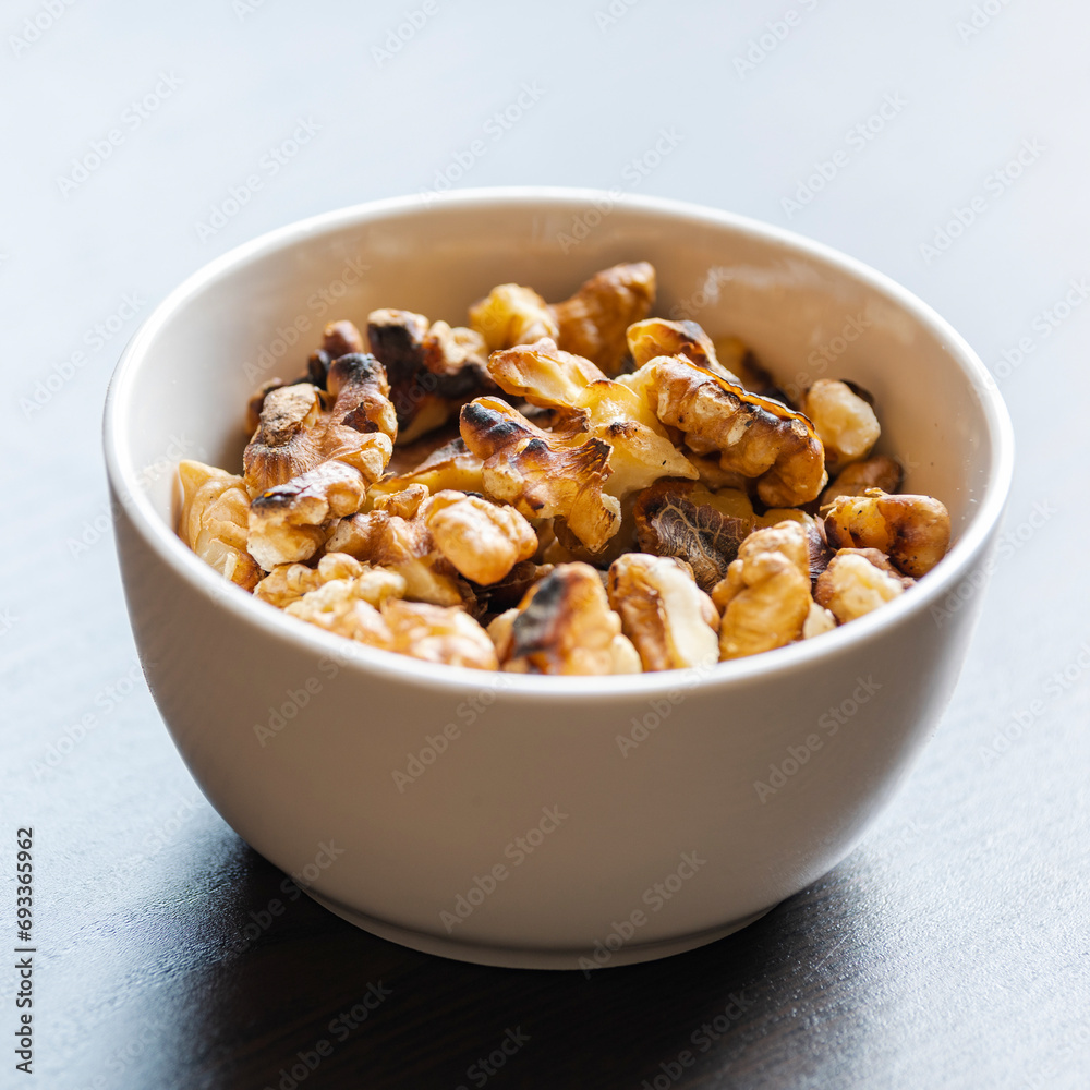 Baked Walnuts in Small White Bowl Baked Walnuts in Small White Bowl