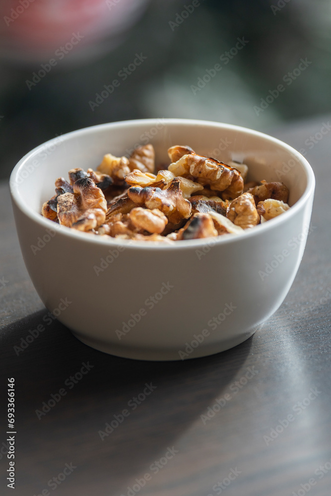 Baked Walnuts in Small White Bowl Baked Walnuts in Small White Bowl