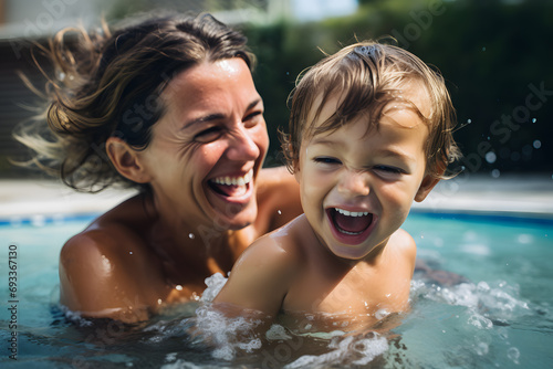 Mother with young boy child having fun in swimming pool