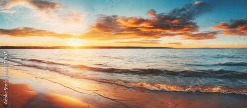 Stunning sunset over Baltic Sea with dreamlike sky, golden sunlight, and picturesque view.