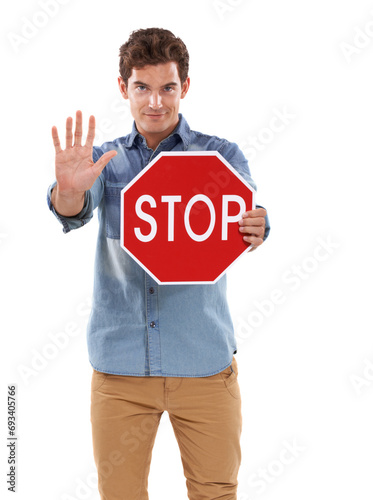 Portrait, man and traffic stop sign, hand and studio isolated on a white background mockup space. Person show red octagon symbol, palm and danger warning, forbidden caution or prohibition in security © Tylan E/peopleimages.com